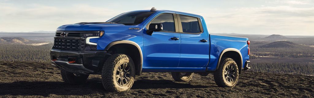 2026 Chevrolet Silverado 1500 standing on top of the mountain, surrounded by mountains.